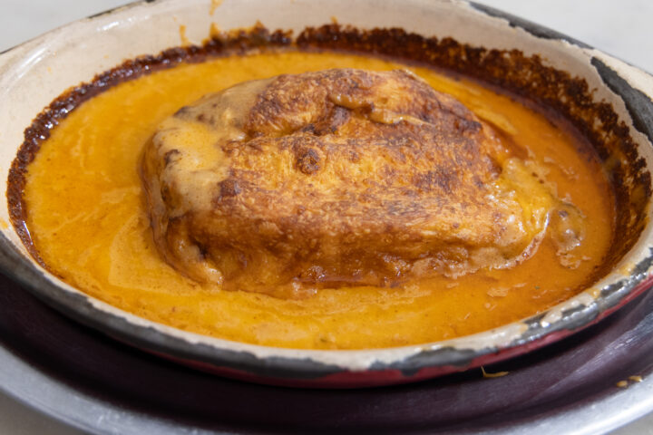 La Chez Meuniere's quenelle, crayfish cream sauce, pilaf rice