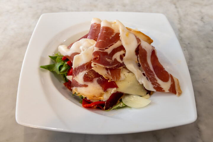 Les Culottes Longues' Mesulin salad with roasted red pepper, cantal cheese, and Iberian ham