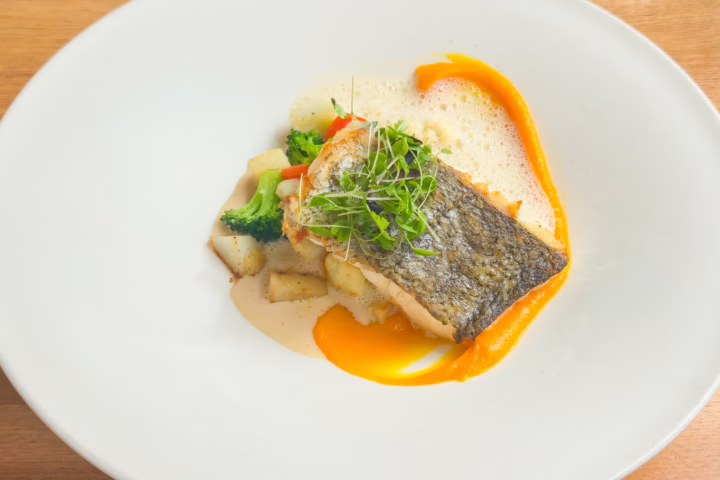 Les Canailles's small boat caught fish, served with celeriac, carrot puree, and a white wine sauce, Paris, France