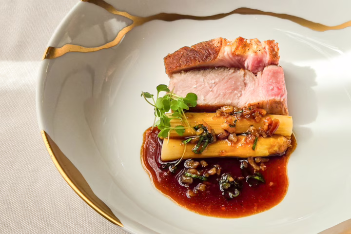 Trente-Trois' roast farmhouse pork from Le Perche, braised white asparagus, and a rich jus, Paris, France